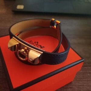 Hermès Black Leather Bracelet with Gold Accents